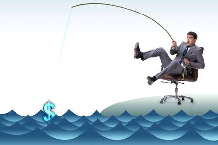 Businessman fishing out dollars from waterの写真素材