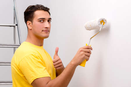 Young man doing home improvementsの写真素材