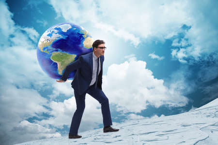 Businessman carrying Earth on his shouldersの写真素材