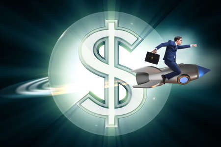 Businessman on rocket flying around dollarの写真素材