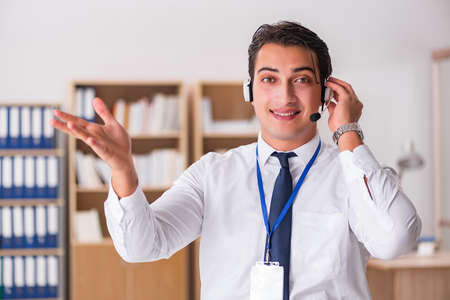 Handsome customer service clerk with headset
