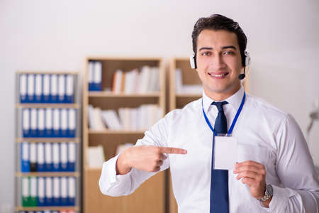 Handsome customer service clerk with headsetの写真素材