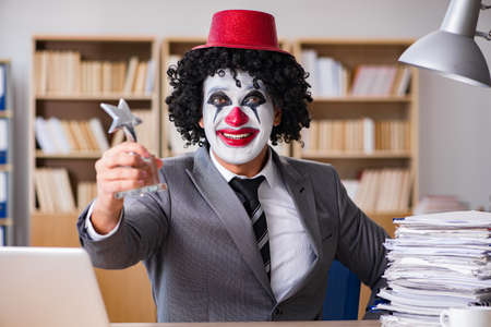 Clown businessman working in the officeの写真素材