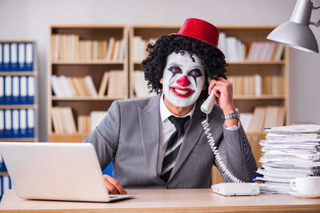 Clown businessman working in the officeの写真素材