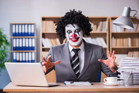 Clown businessman working in the officeの写真素材