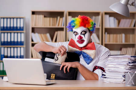 Clown businessman working in the officeの写真素材