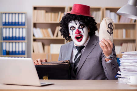 Clown businessman working in the officeの写真素材