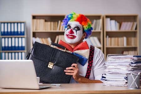 Clown businessman working in the officeの写真素材