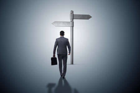 Businessman in difficult choice conceptの写真素材