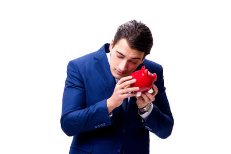 Handsome businessman with piggybank isolated on whiteの写真素材