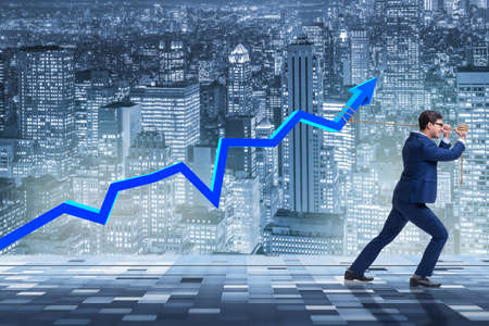 Businessman supporting increase in economyの写真素材