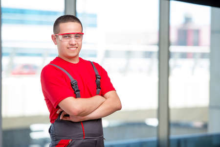 Young furniture carpenter in industrial concept