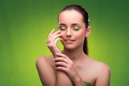 Young woman in beauty concept on green backgroundの写真素材