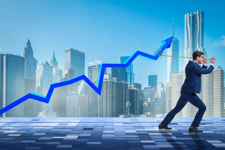 Businessman supporting increase in economy