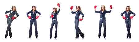 Young woman with boxing gloves isolated on whiteの写真素材