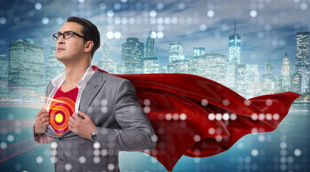 Businessman in superhero concept with red coverの写真素材