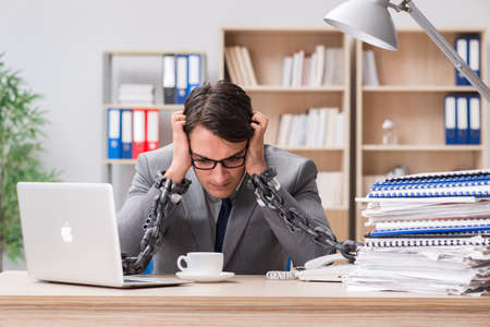 Handsome businessman working in the officeの写真素材