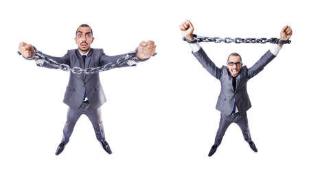 Businessman with handcuffs on whiteの写真素材