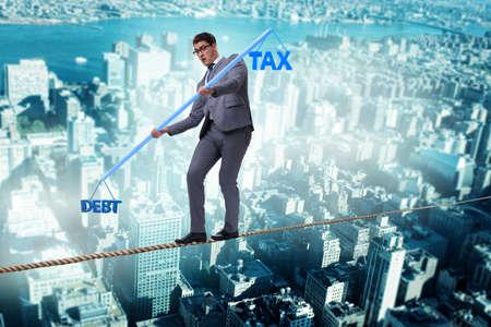 Businessman balancing between debt and tax