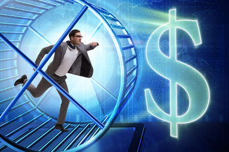 Business concept with businessman running on hamster wheelの写真素材