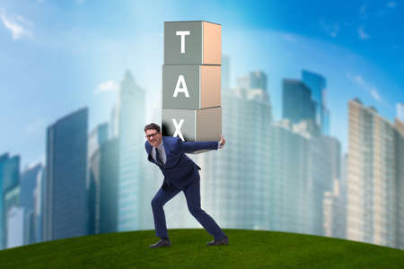 Businessman under heavy tax burdenの写真素材