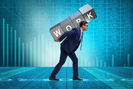 Businessman working too hard in business conceptの写真素材