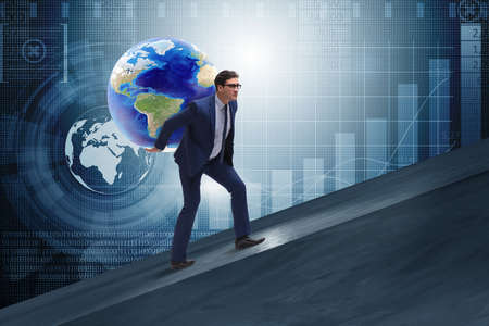 Businessman carrying Earth on his shoulders