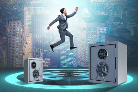 Businessman jumping from safes in business conceptの写真素材