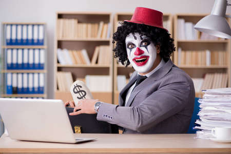 Clown businessman working in the officeの写真素材