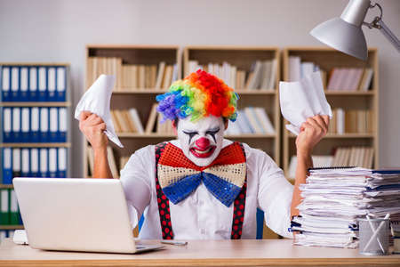 Clown businessman working in the officeの写真素材