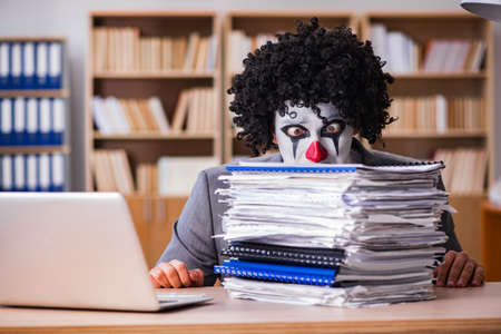 Clown businessman working in the officeの写真素材