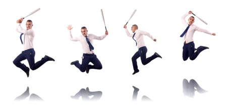 Jumping businessman with baseball batの写真素材