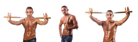 Martial arts warrior with nunchucks on whiteの写真素材