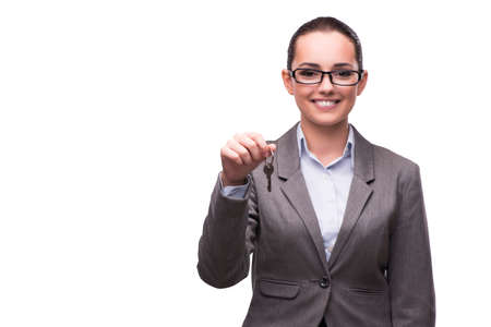 Woman holding keys in real estate conceptの写真素材