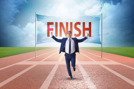 Businessman on the finishing line in competition conceptの写真素材