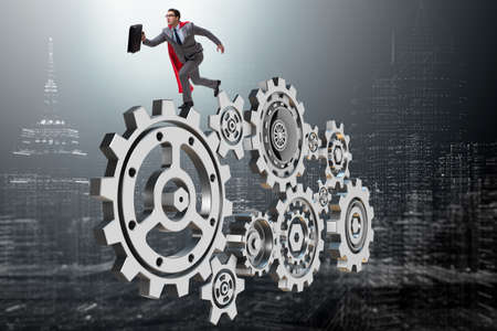 Businessman in teamwork concept with cogwheelsの写真素材