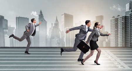 Businesspeople running in competition conceptの写真素材