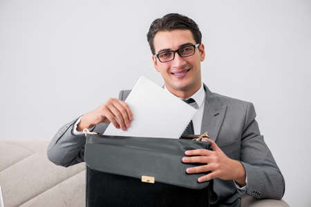 Businessman with briefcase in business conceptの写真素材