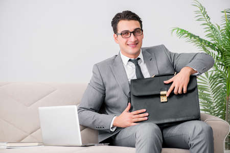 Businessman with briefcase in business conceptの写真素材