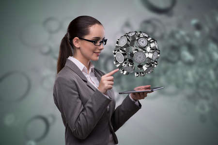 Businesswoman in time management conceptの写真素材