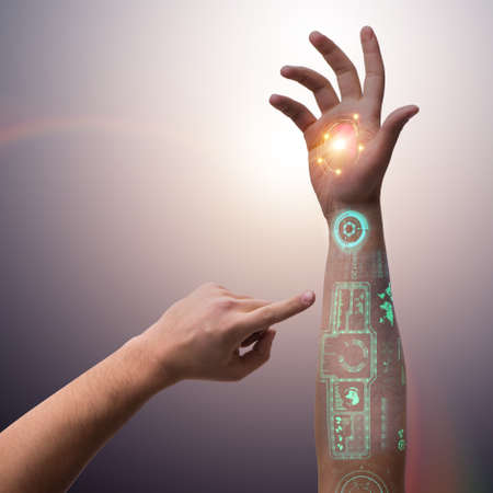 Human robotic hand in futuristic concept