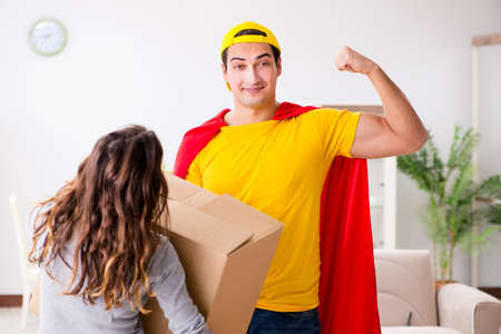 Superhero delivery guy with boxの写真素材