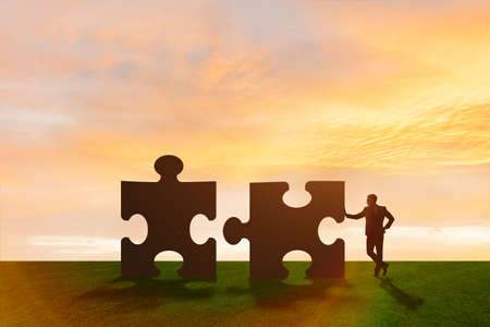 Business metaphor of teamwork with jigsaw puzzleの写真素材