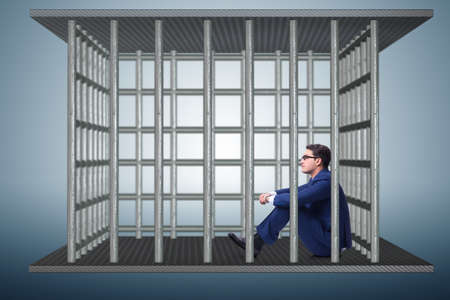 Businessman in the cage business conceptの写真素材