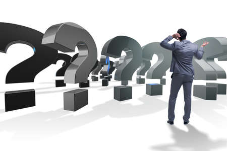 Businessman in uncertainty concept with question marksの写真素材