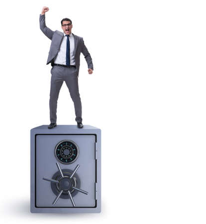 Businessman standing on top of safeの写真素材
