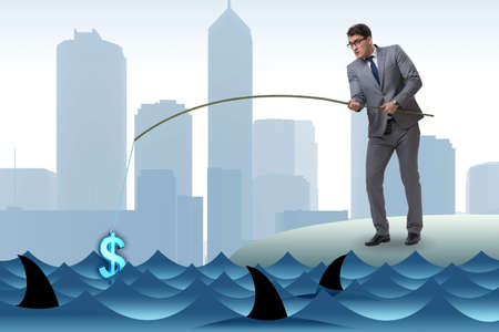 Businessman fishing out dollars from waterの写真素材