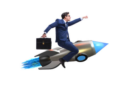 Businessman flying on rocket in business conceptの写真素材