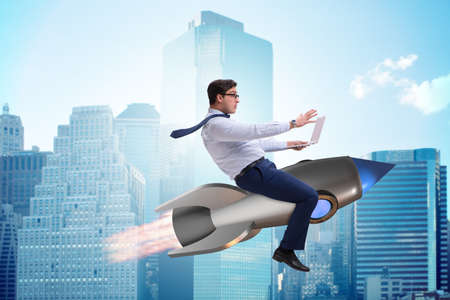 Businessman flying on rocket in business concept