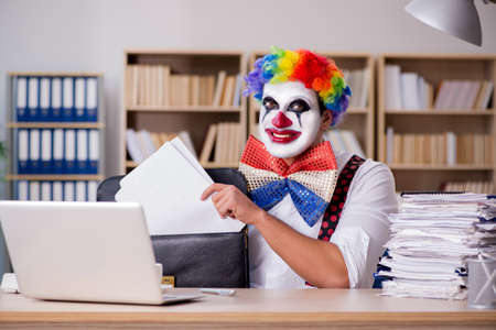 Clown businessman working in the officeの写真素材